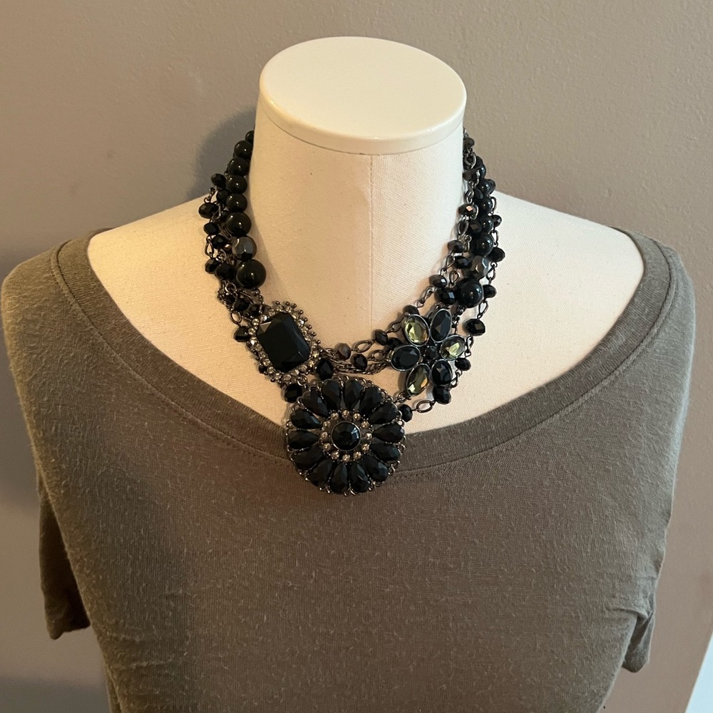 Instant Style hematite plated glass beads. Large flower pin included.